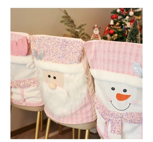 Pink sequin Christmas chair cover with Santa doll and plush faux fur trim detail