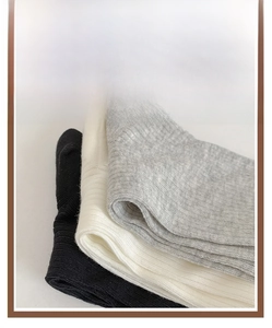 Detailed macro view of ribbed knit texture on stylish ballet style ribbons socks