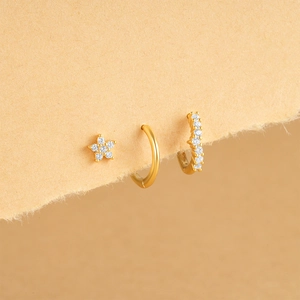 Detailed macro view of S925 silver jewelry set featuring star stud and pearl zircon hoops
