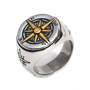 Retro stainless steel compass ring with gold star and silver band in 45-degree view