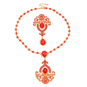 Luxury vintage crystal pendant necklace and brooch set in gold with red rhinestones