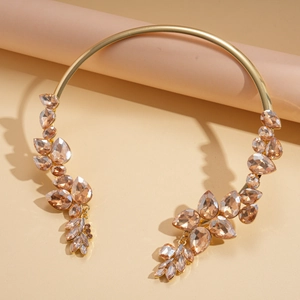 Elegant gold torque necklace with champagne leaf crystals in a vintage palace style