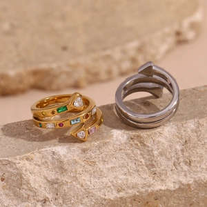 Macro view of 18K gold plated wrap ring with colorful zircons and arrow-shaped ends