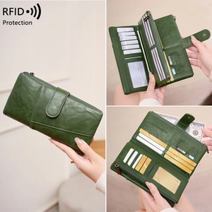 Detailed view of green women's wallet with RFID protection, card slots and zip pocket