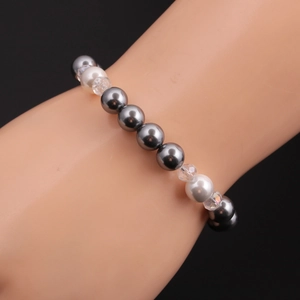 Fashion beaded bracelet for women featuring dark grey pearls and crystal beads on a hand model