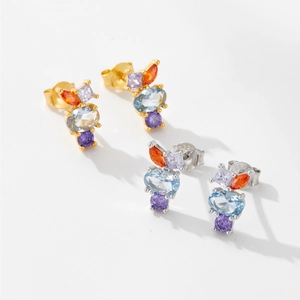 Detail of S925 sterling silver stud earrings featuring colorful zircon stones in gold and silver