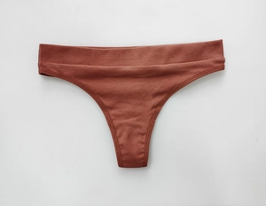 Detailed texture of dark brown ribbed cotton thong for women fitness and sports