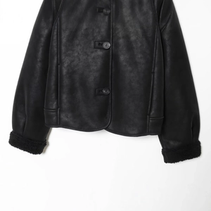 Black faux suede shearling jacket with button closure and cozy fleece lining for winter