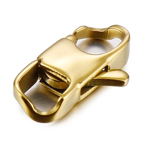 Detail of a polished golden stainless steel lobster clasp accessory with mirror finish