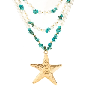 Detail of layered necklace with faux pearls, turquoise stone, and large gold starfish
