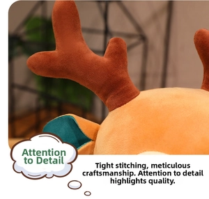 Close-up of brown plush deer antlers and soft orange ears with green lining details