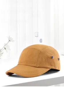 Detail of mustard yellow quick-dry baseball cap featuring breathable side metal eyelets