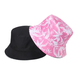 Unisex cotton bucket hats in solid black and pink tropical palm tree print styles