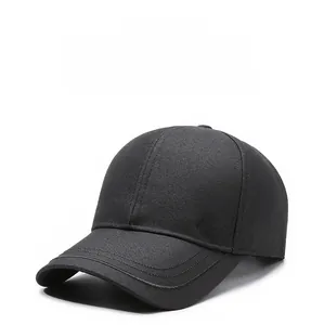 Detail of black cotton twill baseball cap with metal JB logo and decorative visor stitching