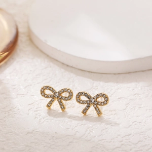 Elegant 18K gold butterfly stud earrings paved with sparkling white cubic zirconia stones