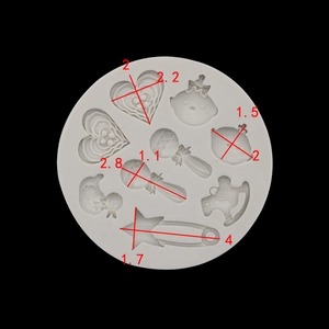 Macro shot of baby shower silicone mold showing detailed dimensions for fondant crafting