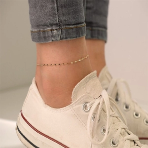 Minimalist gold-plated stainless steel lace chain anklet for women on a model