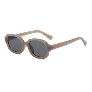 Retro oval sunglasses with champagne frames and grey lenses in 45-degree angle view