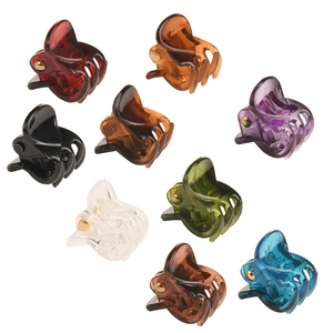 Set of 9 colorful mini plastic hair claw clips with metallic springs for kids' hairstyling