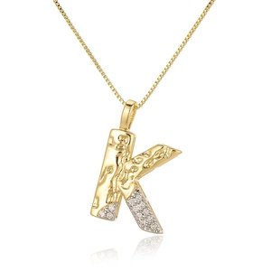 Macro detail of gold letter K pendant with sparkling zircon inlays on a box chain necklace