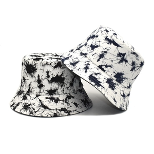 Close-up of black and white tie-dye bucket hat showing cotton canvas texture and stitching