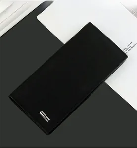 Detail of slim black men long wallet with textured material and silver metal bar accent