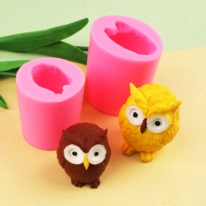 3D owl silicone molds for resin plaster and two finished owl figurines in pink and brown
