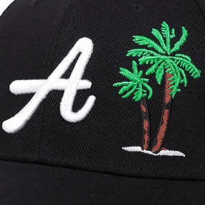 Classic black cotton baseball cap featuring detailed white letter A and palm tree embroidery