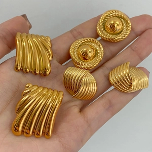 Set of gold geometric stainless steel stud earrings featuring spiral and wavy metal textures