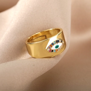 Detailed view of bohemian wide band evil eye ring with colorful zircon inlay on silk