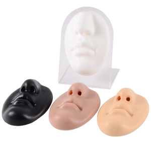 Silicone nose and lip piercing models in four skin tones with acrylic display stand