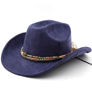 Detail of navy blue suede cowboy hat featuring colorful bohemian beaded strap and texture