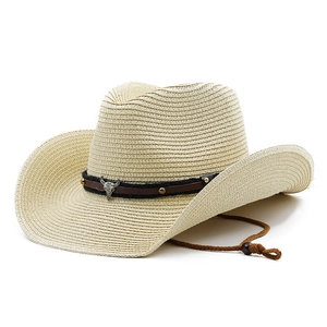 Western style straw cowboy hat with wide brim, brown leather band, and bull head ornament