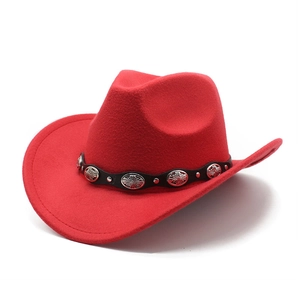 Detail of red western cowboy hat featuring black leather band and silver metal conchos