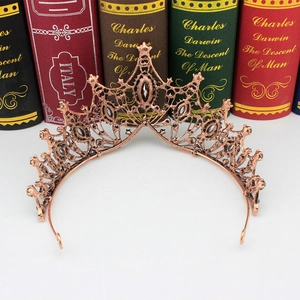 Macro detail of Baroque bronze crown featuring grey crystals and vintage hollow metalwork