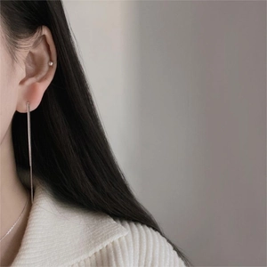 Minimalist long 925 sterling silver snake chain drop earrings on model's ear