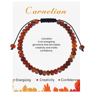 Detail of Carnelian beaded bracelet with adjustable black cord on a gift display card