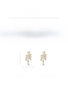 Detailed view of vintage crystal flower earrings with faux pearls and fringe tassels