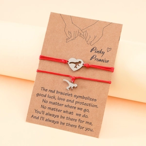 Dinosaur charm handmade red woven bracelets set for couples on Pinky Promise card