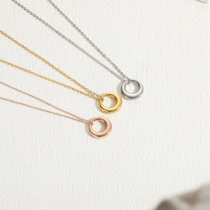 Minimalist circular pendant necklaces in gold, silver, and rose gold plating