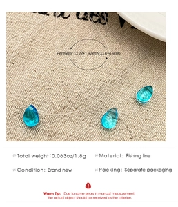 Detail showing blue teardrop glass pendant on invisible fishing line with size specs