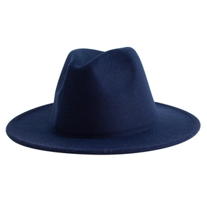 Close-up of deep blue wool fedora hat showing refined felt texture and wide brim