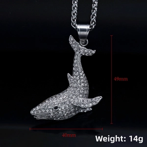 Close-up of silver whale pendant with white rhinestones measuring 49mm by 40mm and 14g