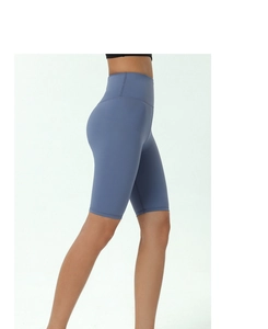 Side view of high-waisted grey-blue yoga shorts with seamless elastic performance fabric