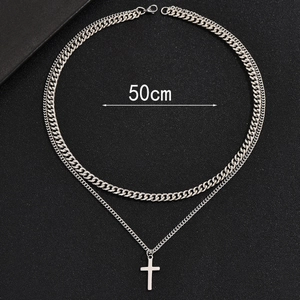 Detail of 50cm silver double-layer Cuban chain necklace with minimalist cross pendant