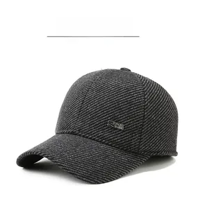 Detail of winter men's baseball cap featuring grey twill wool fabric and metal Sport logo