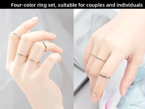 Detail view of minimalist titanium steel stacking rings in silver and gold finishes