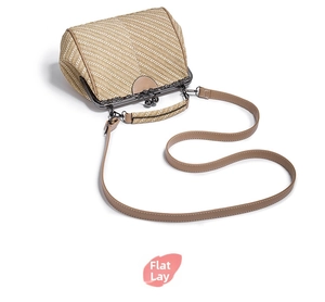 Detail view of woven textured kiss lock bag with retro metallic frame and brown strap