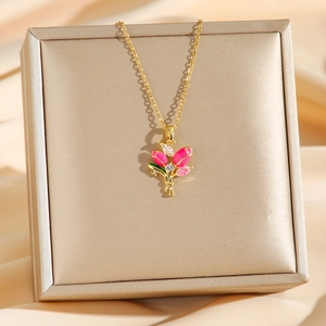 Elegant gold tulip pendant necklace with pink petals and zircons on champagne silk
