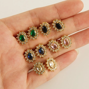 Golden sunburst stud earrings set with zircon halos in five vibrant gemstone colors